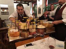 Italian cheese chop counter with employees