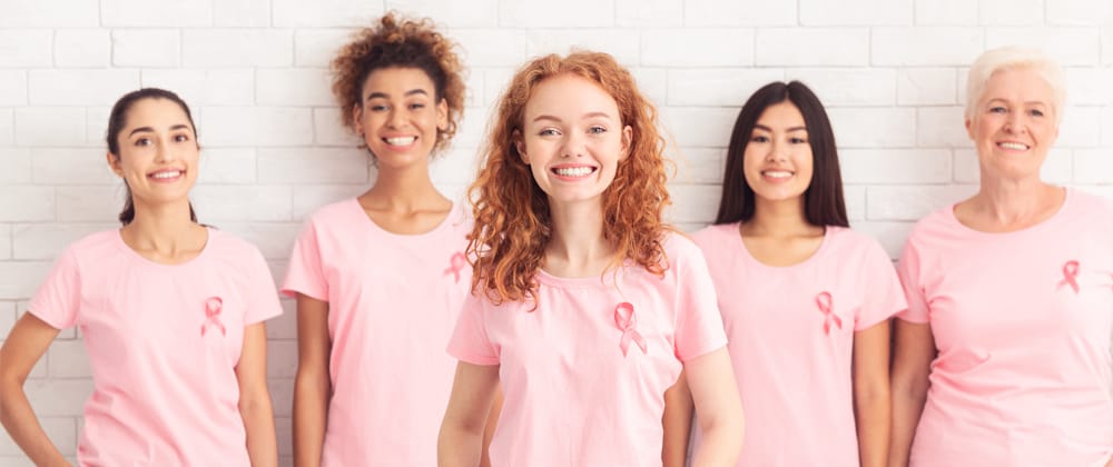 Woman wearing breast cancer awareness shirts