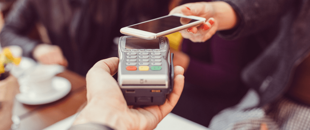 Person scanning phone as digital payment