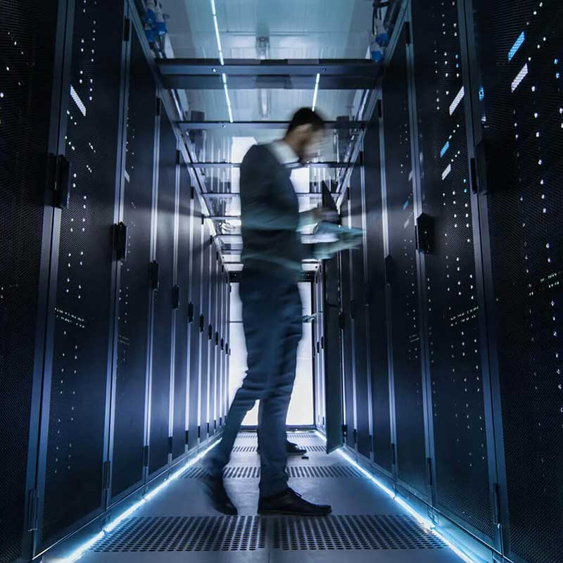 blurred person standing in server room