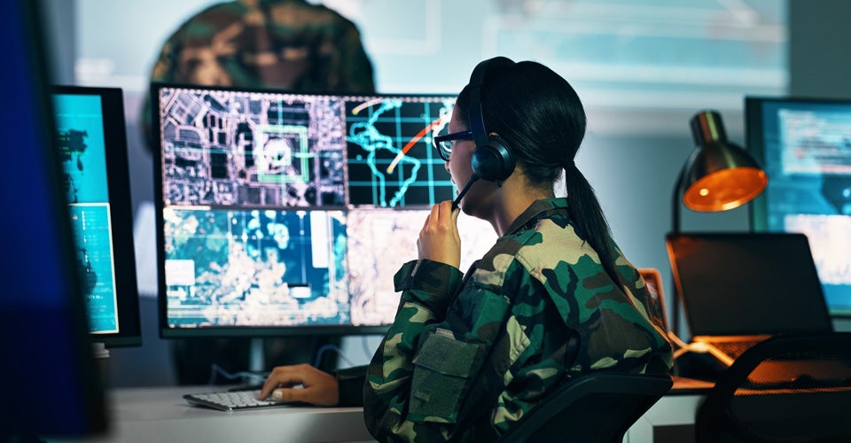 Military command center, computer screen and woman in surveillance, headset and tech for communication. Security, world satellite map and soldier at monitor in army office at government control room.