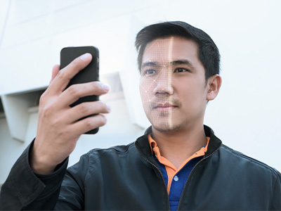 Person holding a smartphone for digital verification