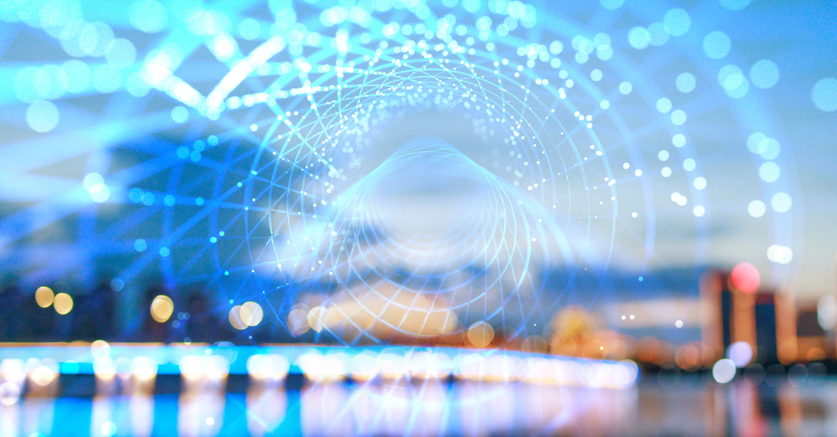 Abstract digital network tunnel over blurred cityscape lights