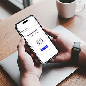 hands holding mobile phone for authentication