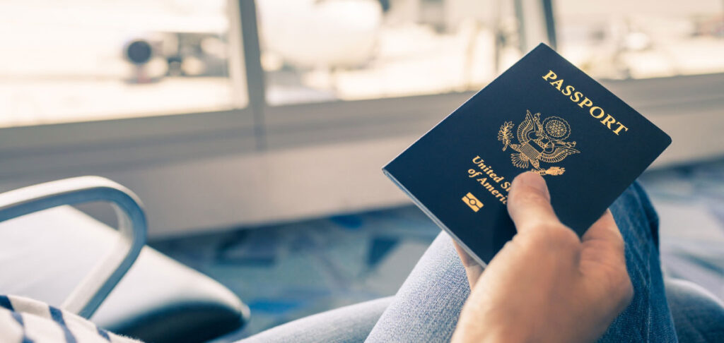 hand holding USA passport book