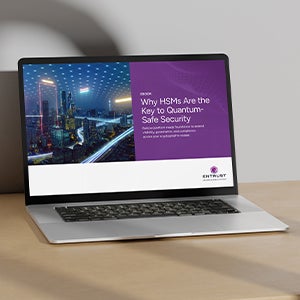 Laptop displaying a presentation on quantum-safe security with cityscape background on a desk