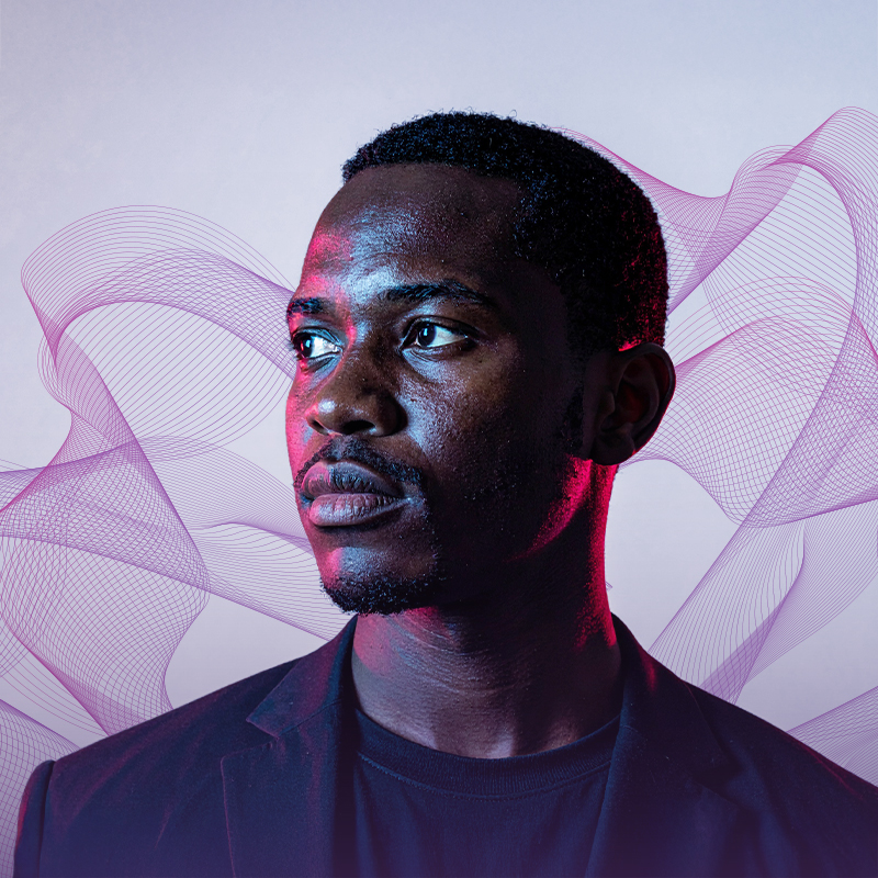 man gazing to the left with purple hue abstract background
