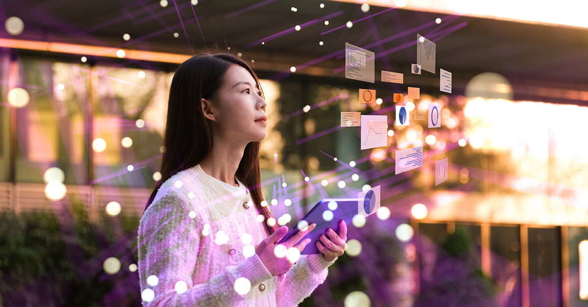 Person holding a tablet with digital analytics charts and data visuals floating in front of them