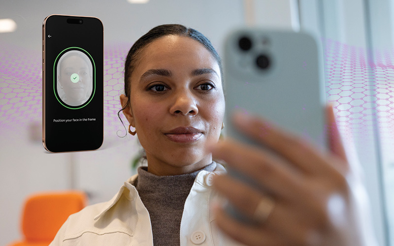 woman holding phone in front of face