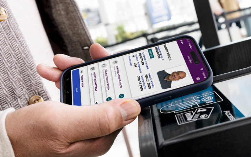 man holding phone with digital ID
