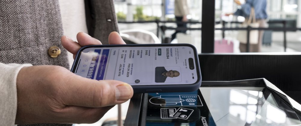 Mobile digital ID being scanned at a self-service verification kiosk