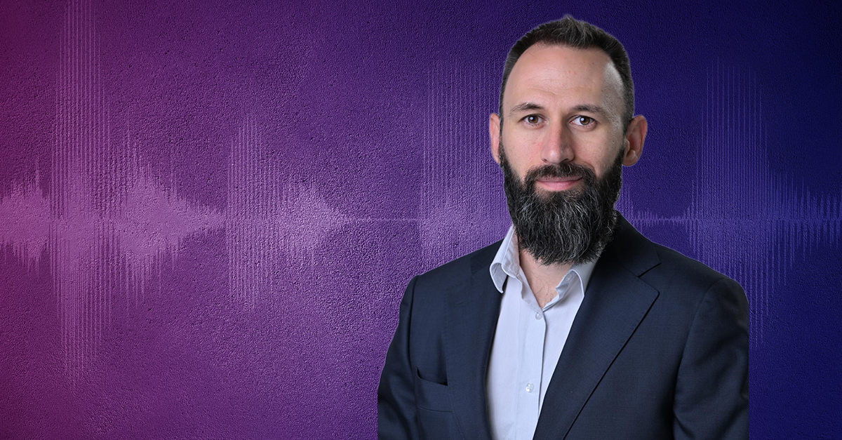 Professional headshot on a purple and blue background