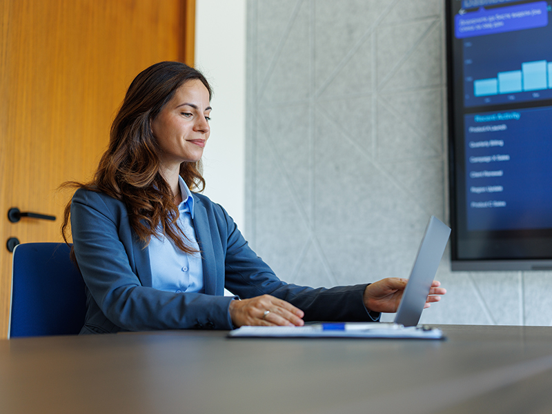 Person sitting at a desk with a laptop