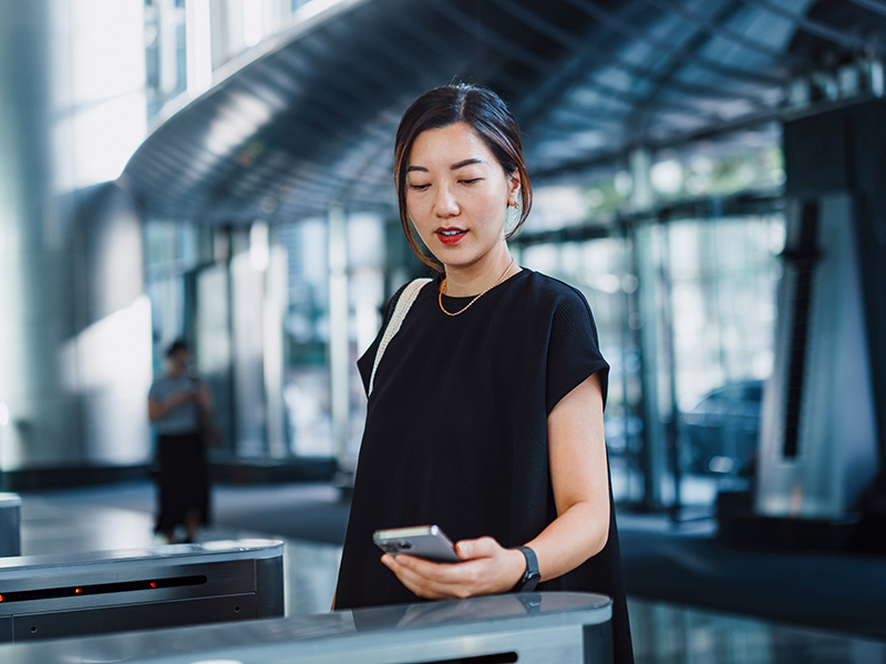 Person scanning phone at a security check