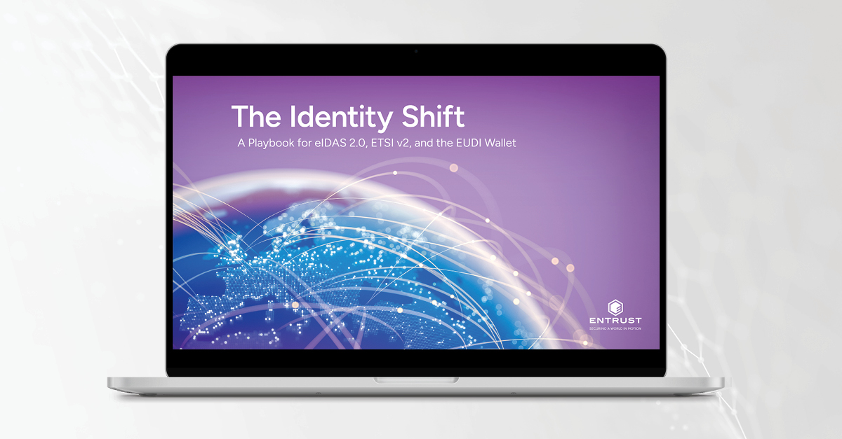 Laptop displaying "The Identity Shift" eBook cover with global digital identity network graphic