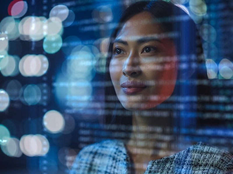 Person standing in front of an abstract screen