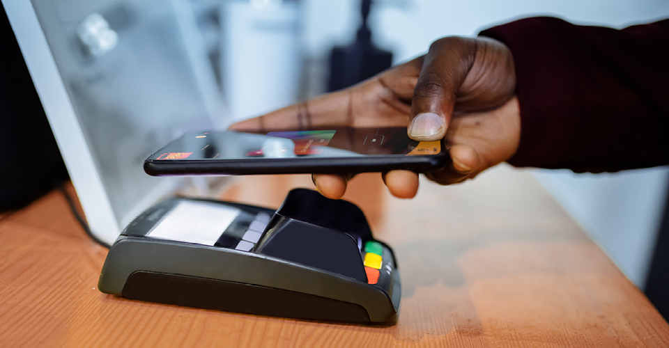 Smartphone held over a contactless payment terminal