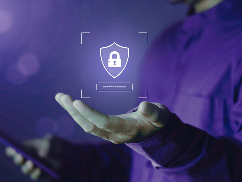 Designed graphic of someone's hand holding a lock and security icon